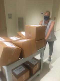 Dr. Robinson gets ready to ship lab kits at the beginning of the fall semester